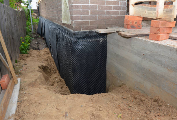 Happy homeowners after waterproofing job in Glen Arm